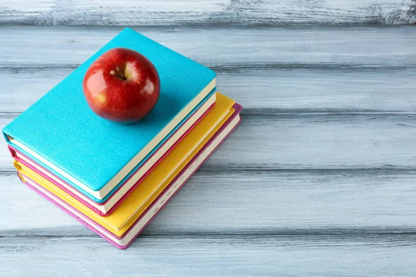 Pile of books and apple — Stock Photo, Image