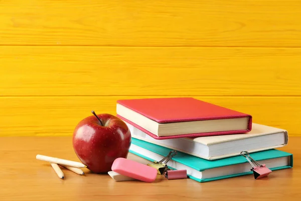 Pile of books and apple — Stock Photo, Image