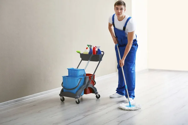 Young man with mop — Stock Photo, Image