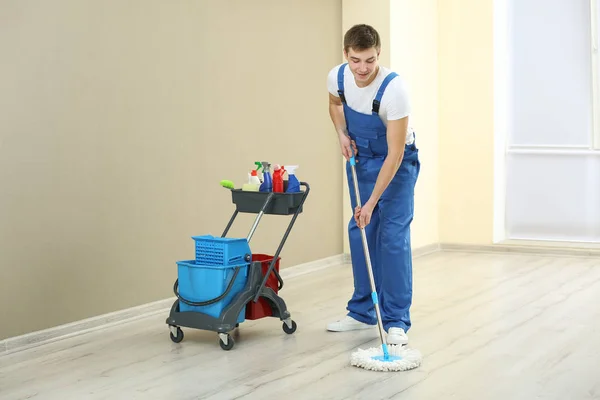 Young man with mop — Stock Photo, Image