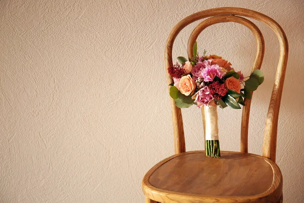 Bridal bouquet on chair — Stock Photo, Image
