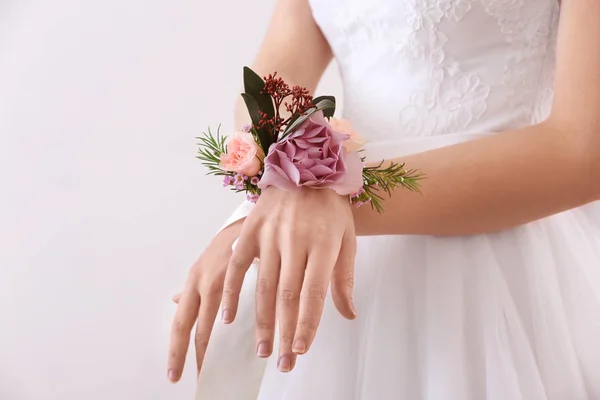 Boutonniere on female hand — Stock Photo, Image