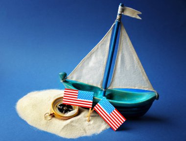 Wooden boat, USA flags and compass  clipart