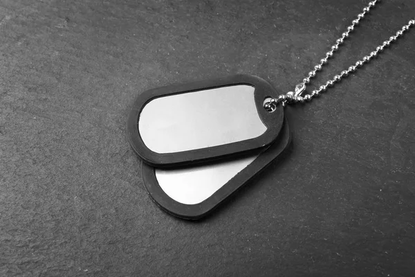 Military ID tags on dark — Stock Photo, Image