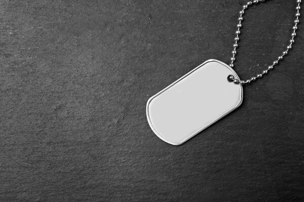 Military ID tag on dark
