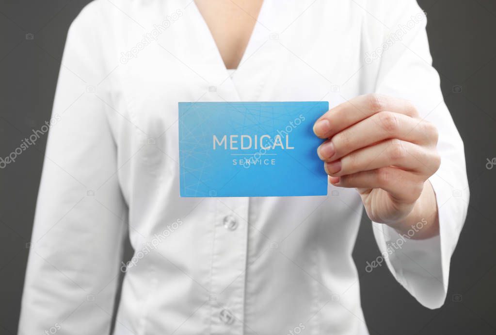 Doctor holding business card