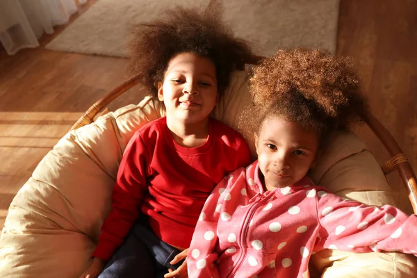 Two Cute African Girls Sitting Cozy Chair — Stock Photo, Image