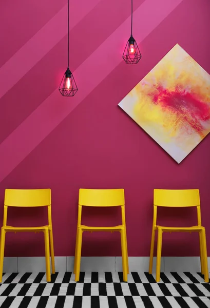 Chairs on wall background — Stock Photo, Image