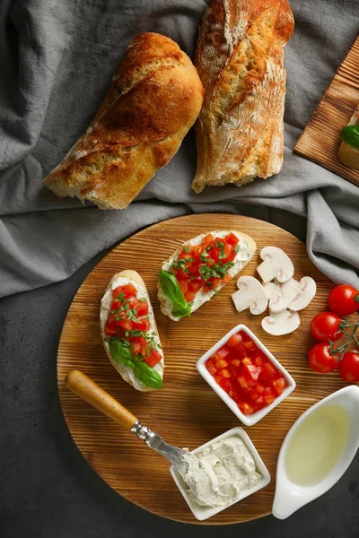 Fresh ingredients for delicious bruschetta — Stock Photo, Image