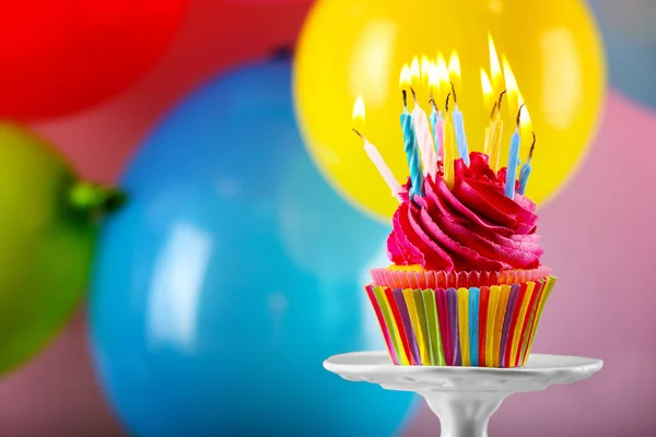 Tasty cupcake with candles — Stock Photo, Image