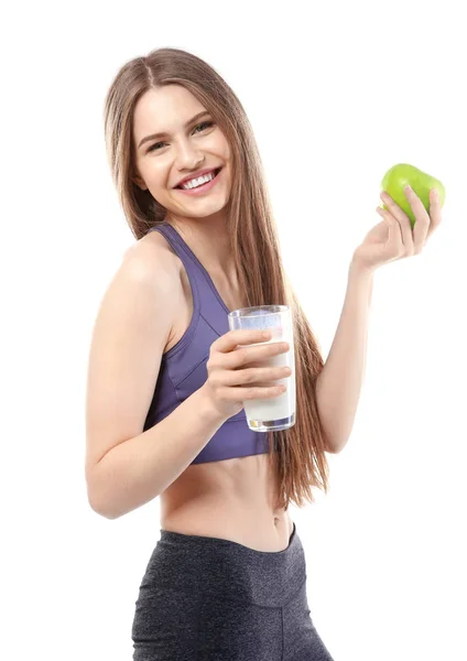 Kvinna med glas mjölk och apple — Stockfoto