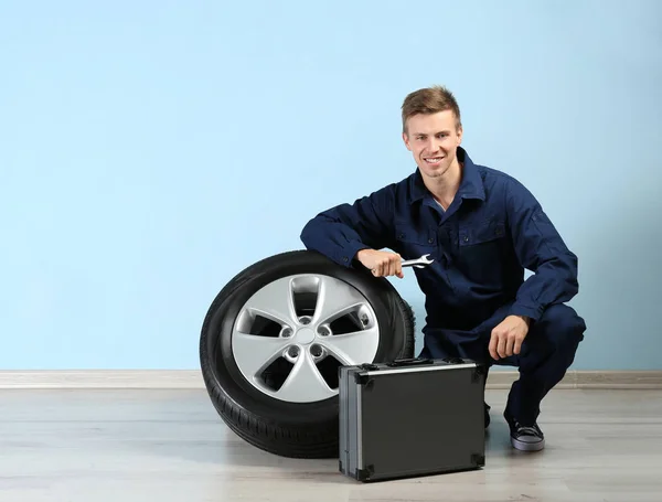 Young mechanic in uniform with tools box — Stock Photo, Image