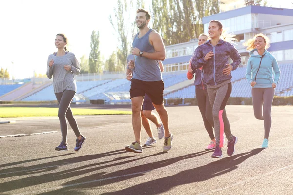 Sportsmen Running Stadium — Stock Photo, Image