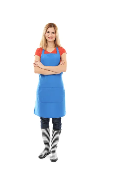 Beautiful woman in blue apron — Stock Photo, Image