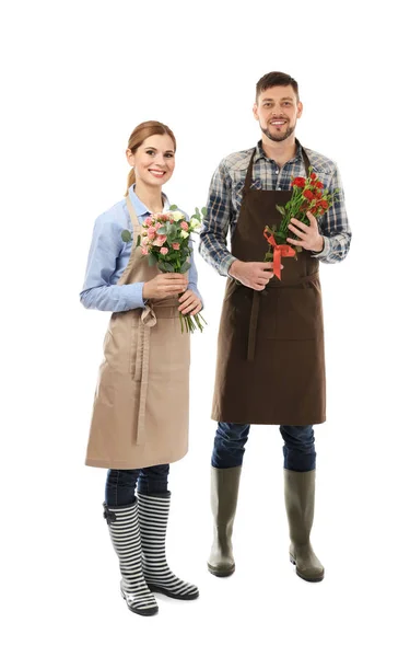 Dos floristas sosteniendo plantas de la casa — Foto de Stock