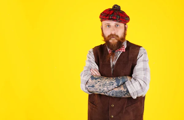 Young bearded man in plaid cap — Stock Photo, Image