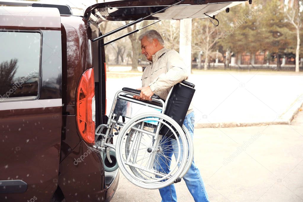 Man loading wheelchair