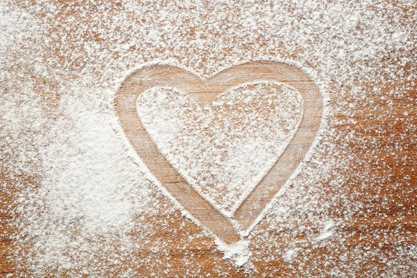 Heart drawn on flour