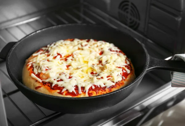 Pizza baking in oven — Stock Photo, Image