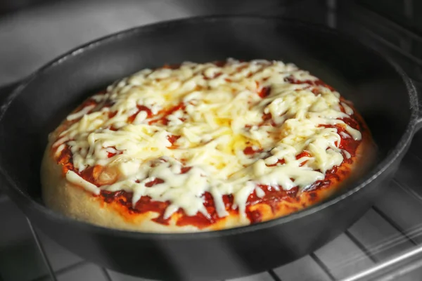 Pizza baking in oven — Stock Photo, Image