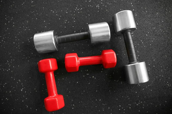 Different dumbbells  in gym — Stock Photo, Image