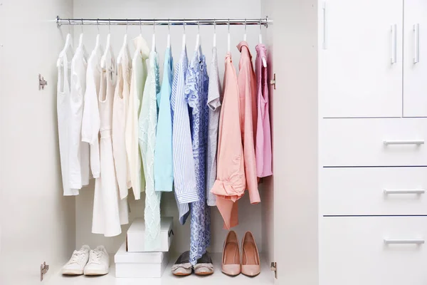 Clothes hanging on rack — Stock Photo, Image