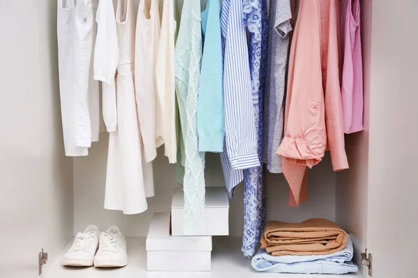 Clothes hanging on rack — Stock Photo, Image