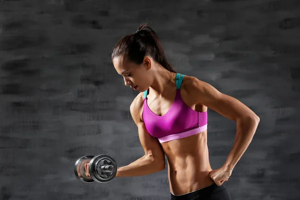 Sporty woman with dumbbell — Stock Photo, Image