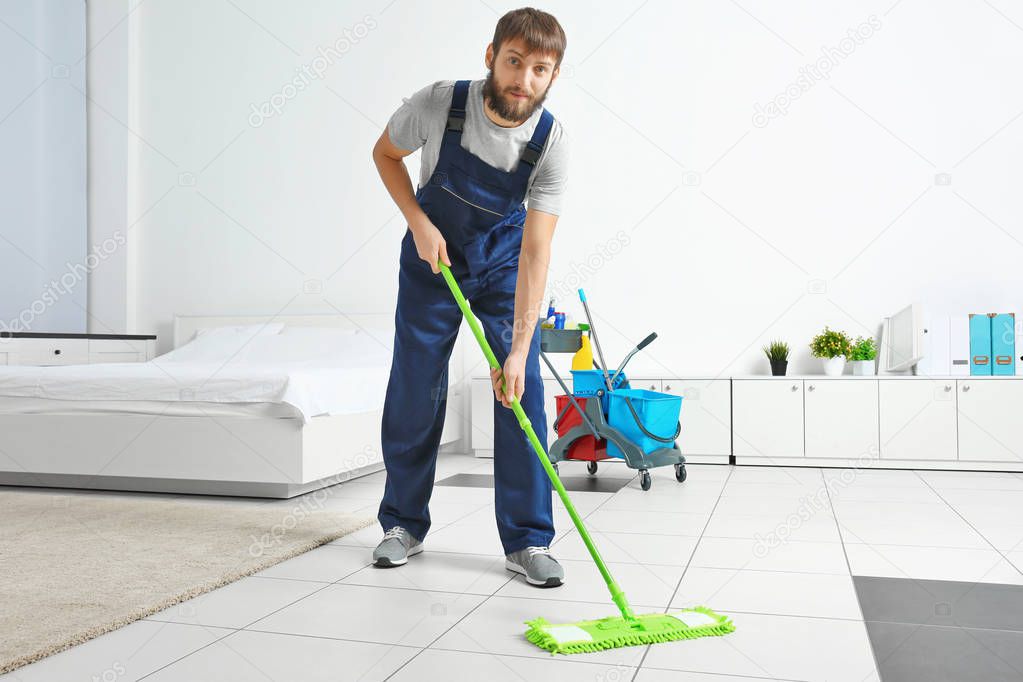 man moping floor 