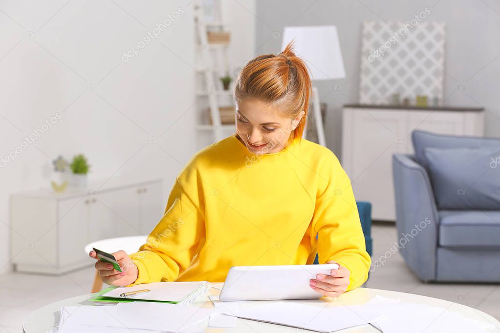 young woman calculating taxes 