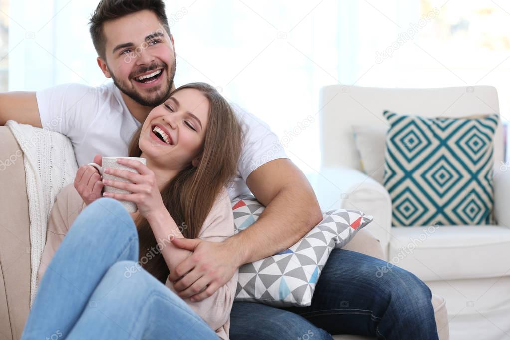 Young couple sitting on sofa