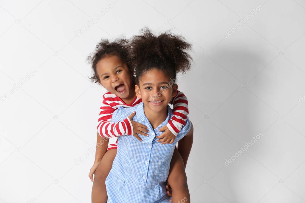 Two cute African girls on white background