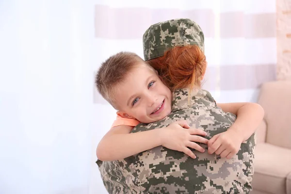 Female  soldier and little kid — Stock Photo, Image