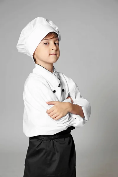 Lindo chico en uniforme de chef — Foto de Stock