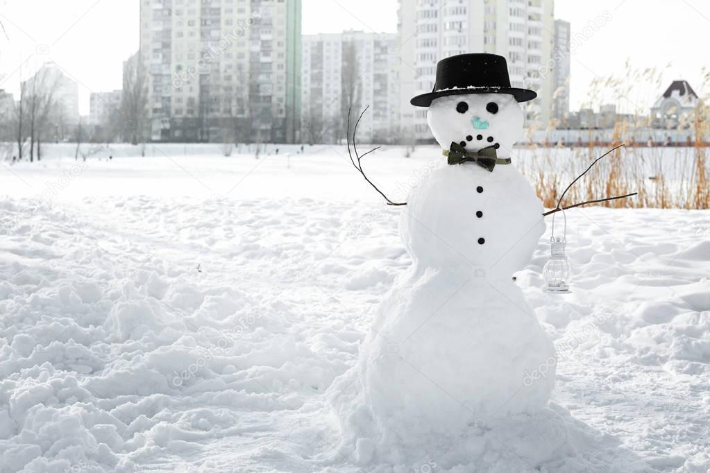 Christmas snowman in wintertime