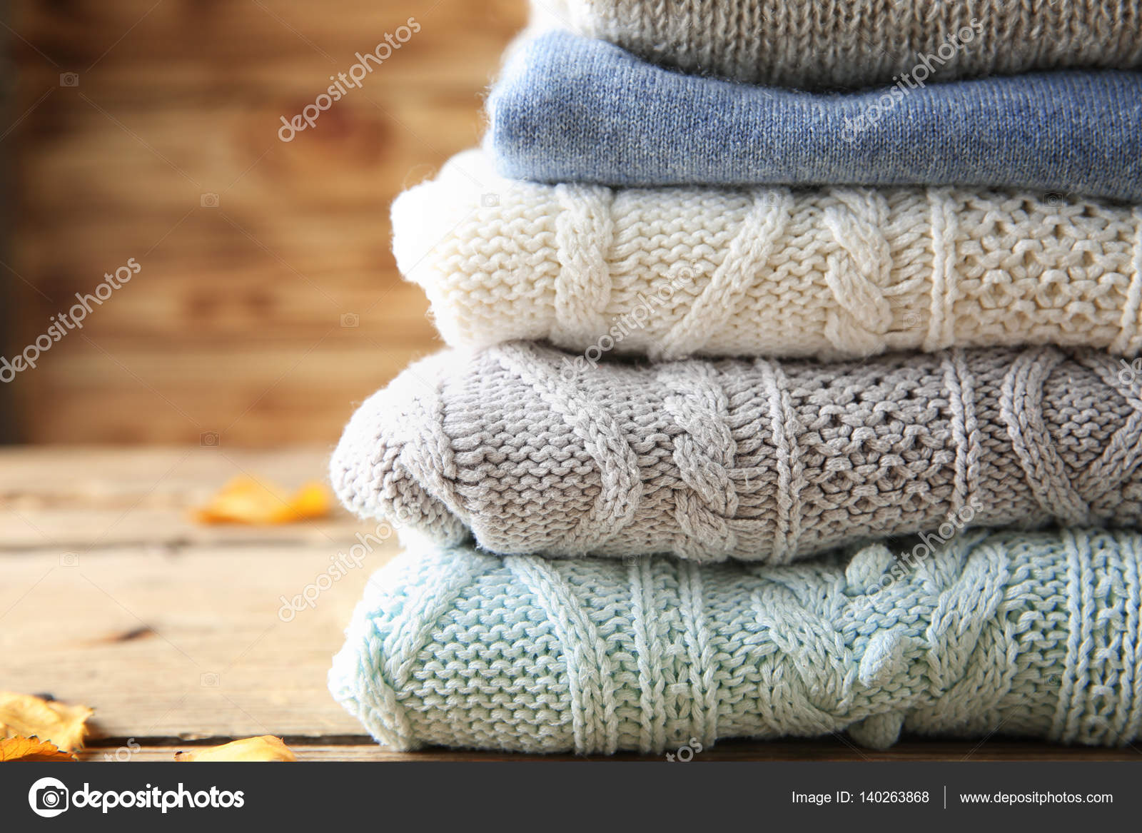 Stack of woolen clothes Stock Photo by ©belchonock 140263868