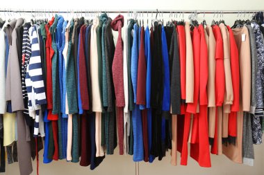 rack with different clothes clipart