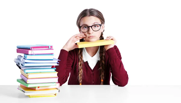 Teenage girl with pile of books — Stock Photo, Image