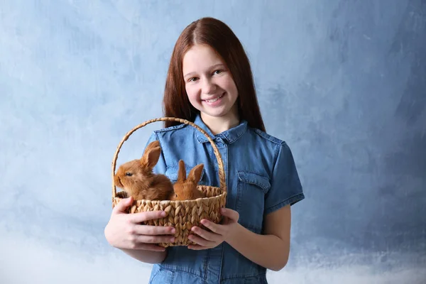 Cute girl holding rabbit — Stock Photo, Image