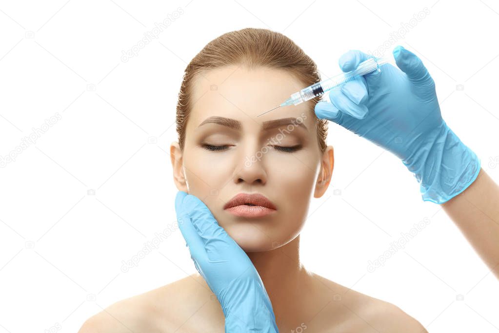 Young woman having cosmetic injection  