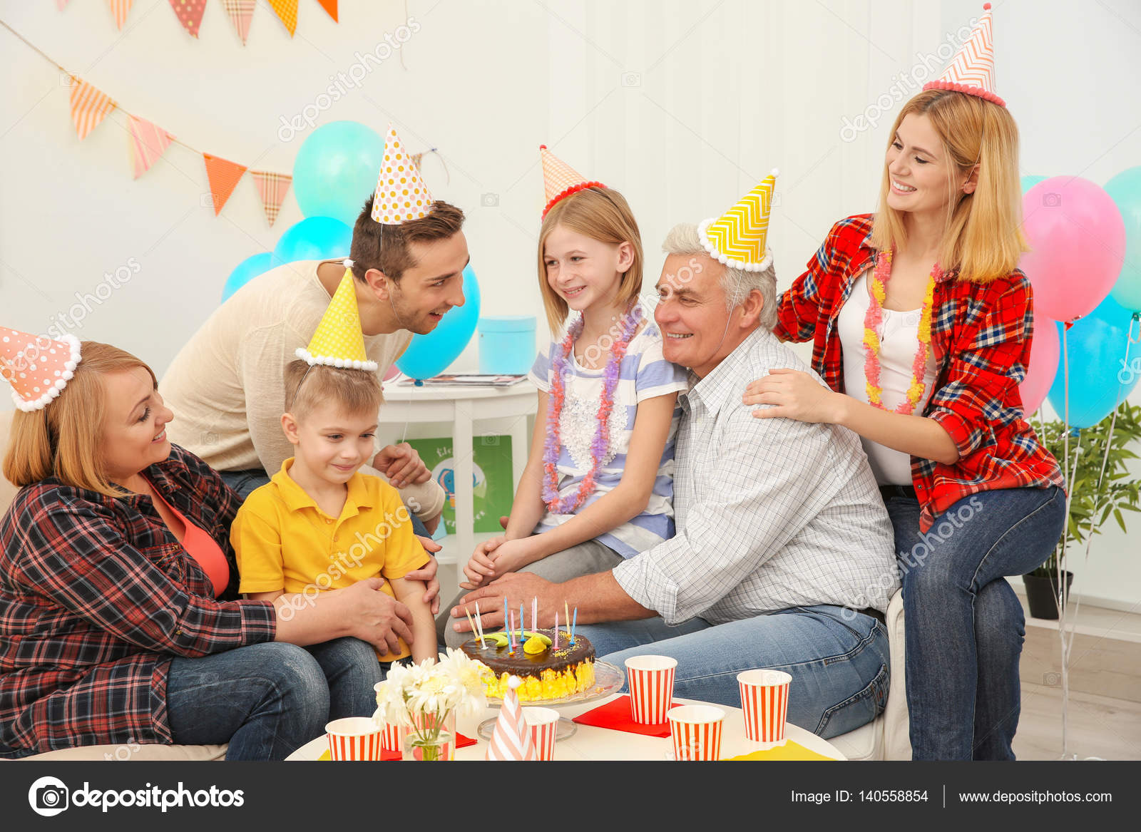 Family celebrating Birthday party — Stock Photo © belchonock #140558854