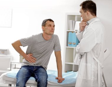 Patient talking with doctor at hospital clipart