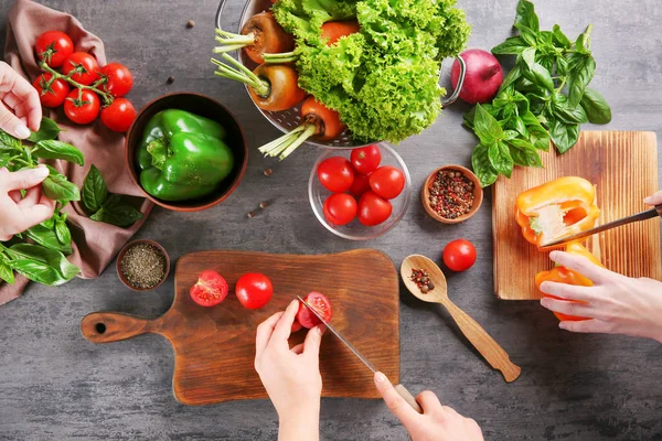 Group of people making salad