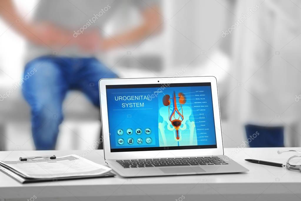 Laptop with urology image on desk