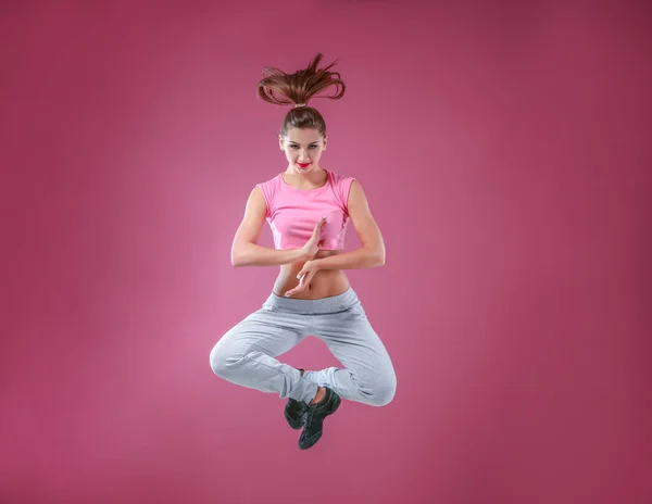 Hip hop dancer dancing on pink background — Stock Photo, Image