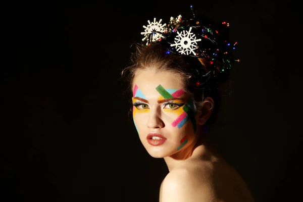 Junge Frau mit kreativem Make-up — Stockfoto