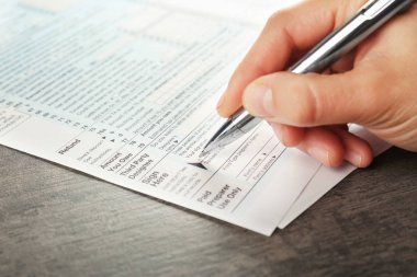Woman filling tax return form clipart