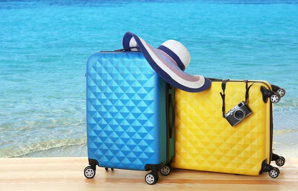 Suitcases on seascape background — Stock Photo, Image