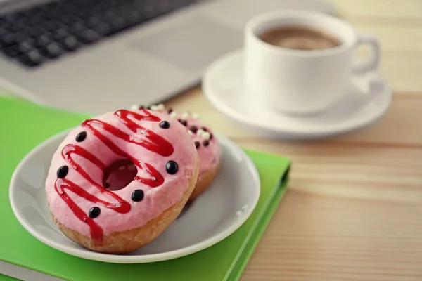 Delicious donuts with cup of coffee — Stock Photo, Image