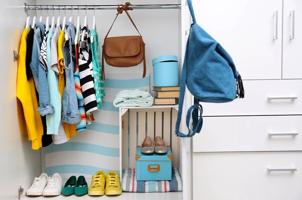 Clothes hanging on a rack — Stock Photo, Image